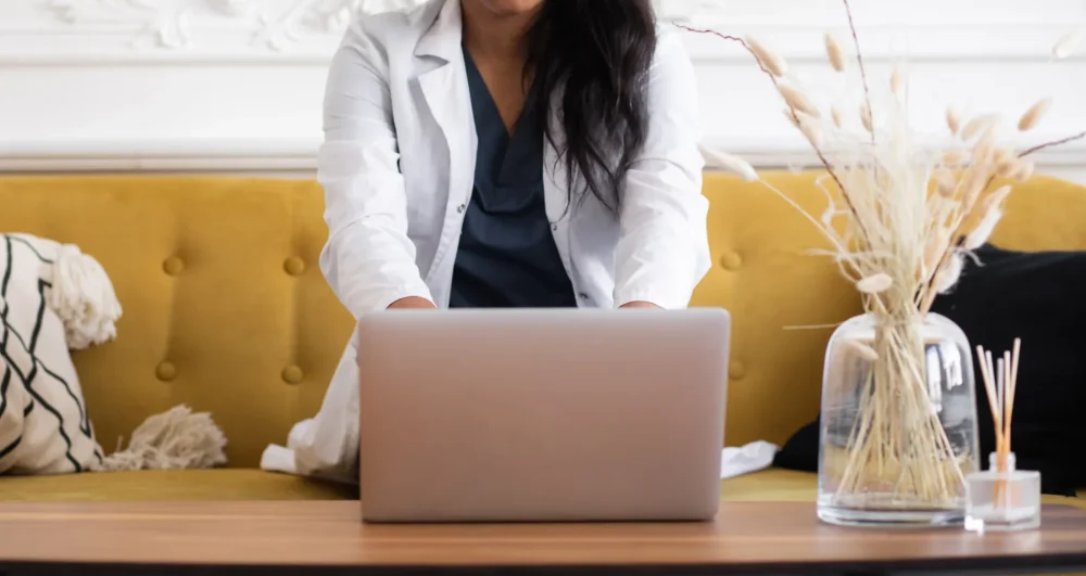 Online CBT Therapy & Psychotherapy Services in Sydenham, working on laptop